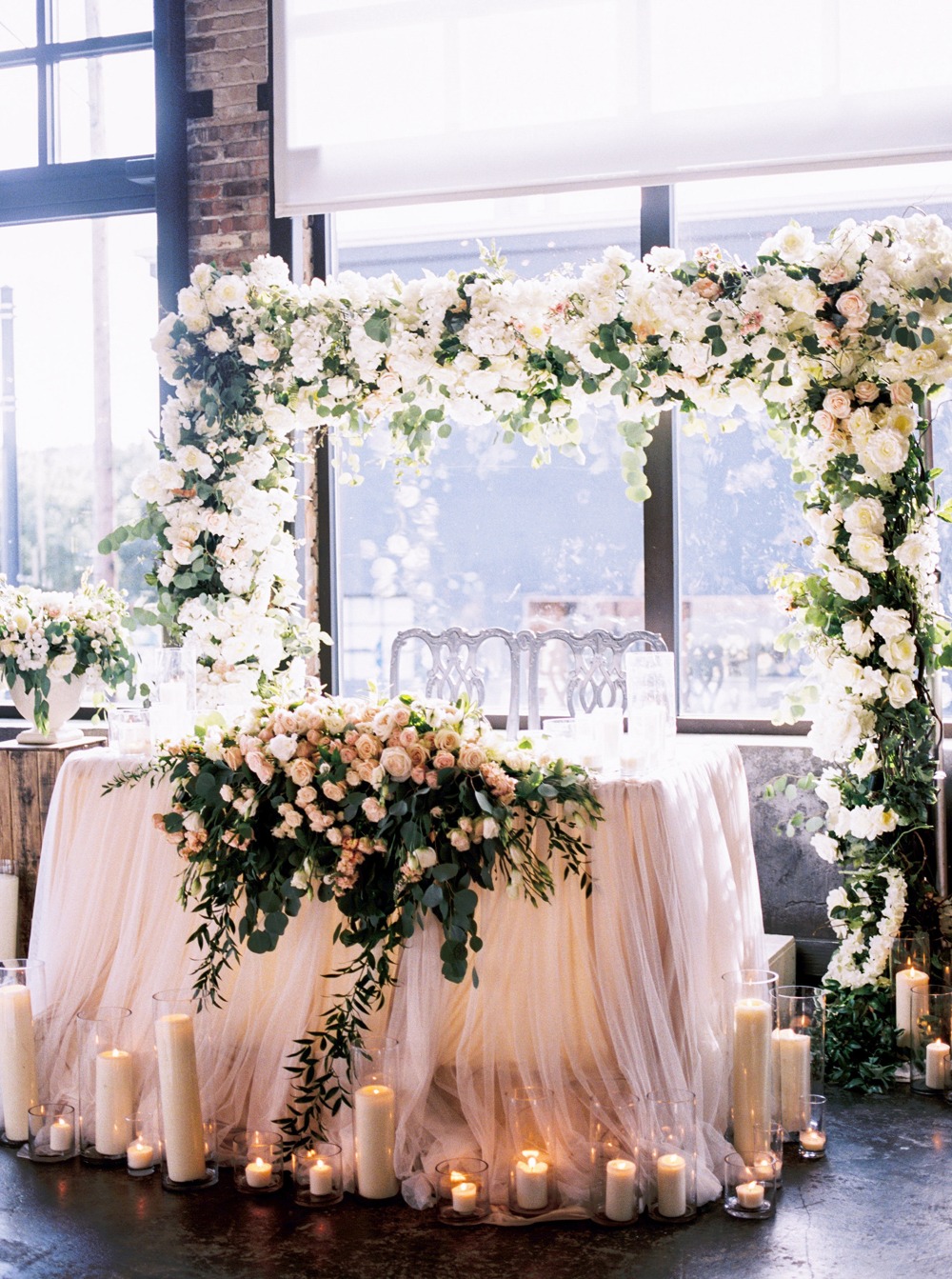 Flower covered sweetheart table