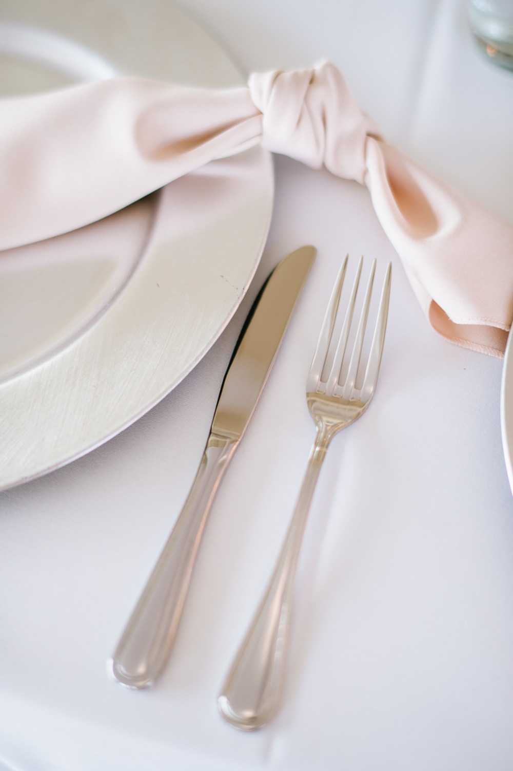 blush and silver wedding place setting