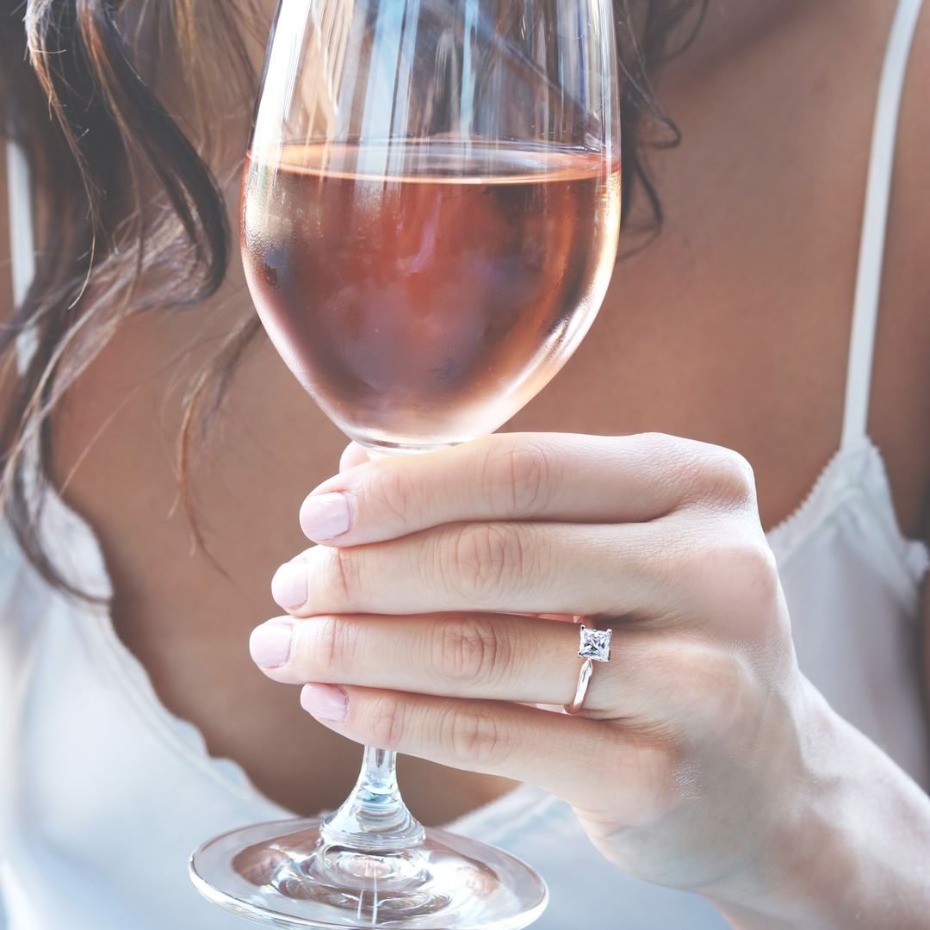 Bride drinking rose wine with MiaDonna ring