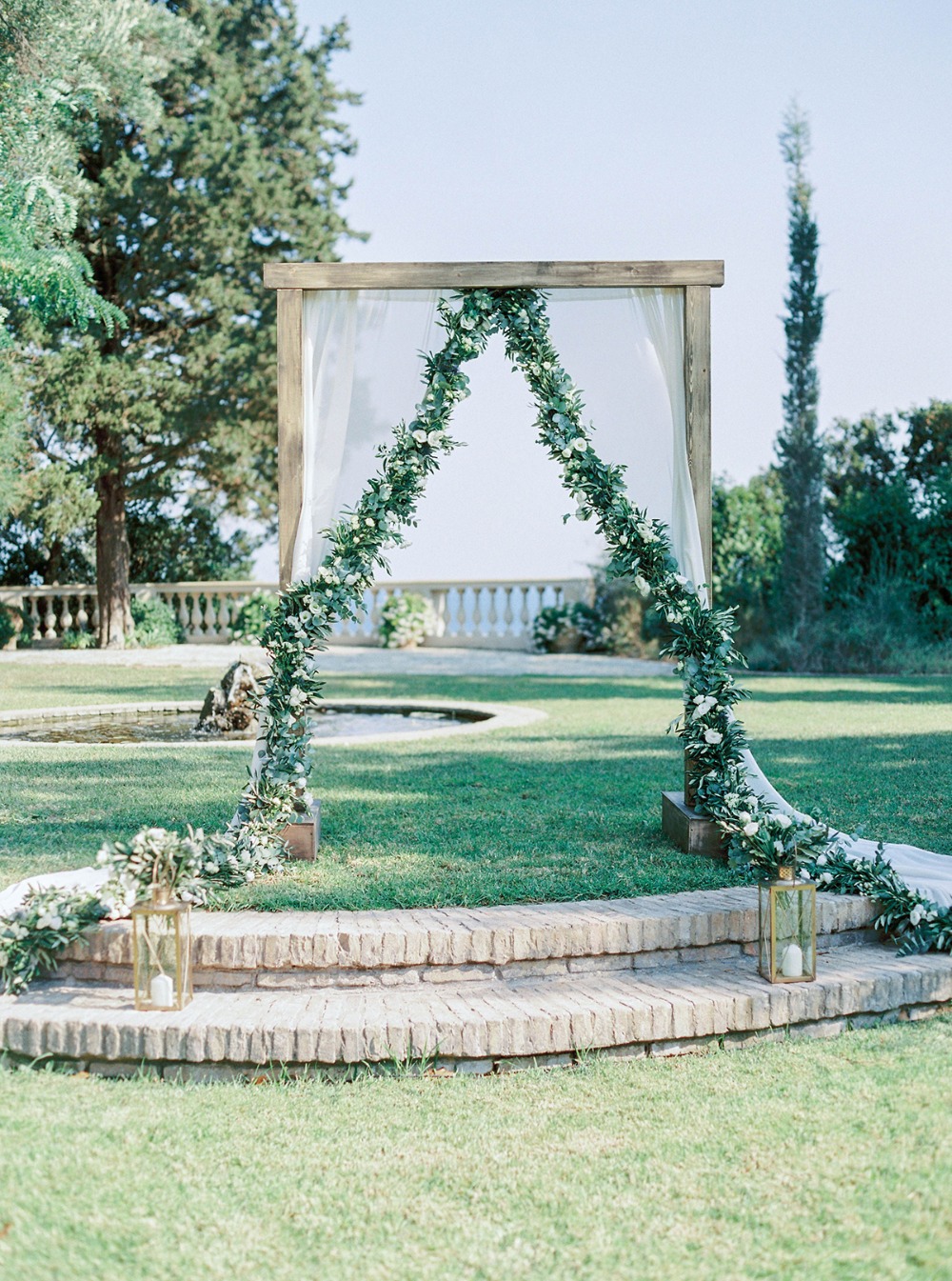 romantic curtain and floral garland wedding backdrop