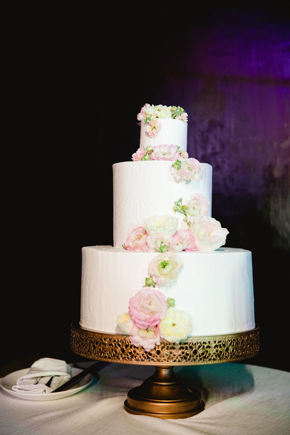flower accented white wedding cake