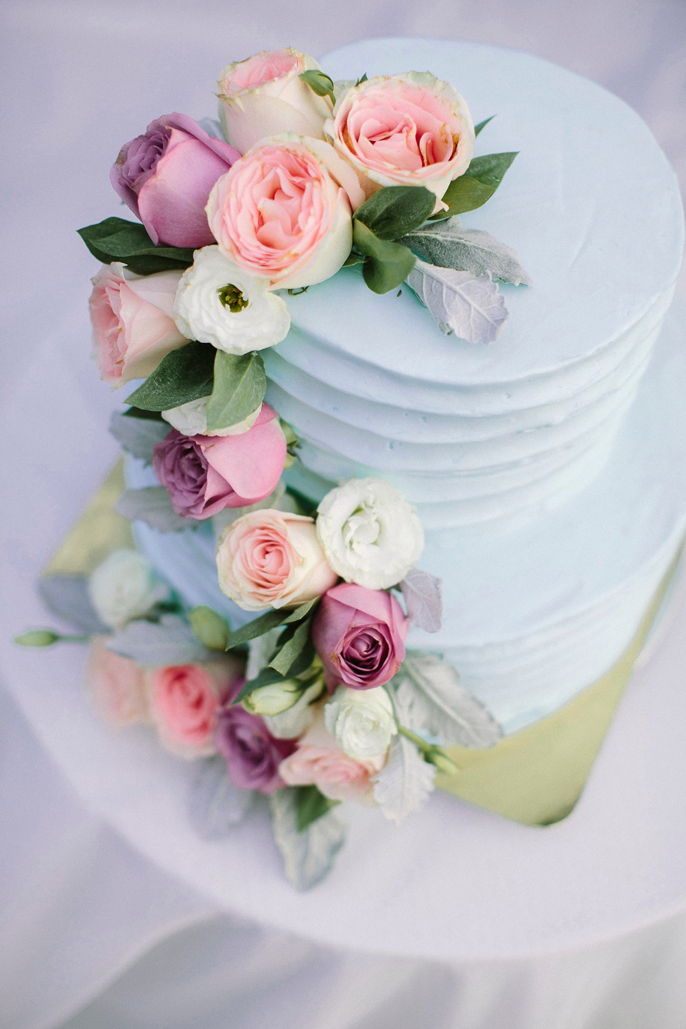 Blue wedding cake with florals
