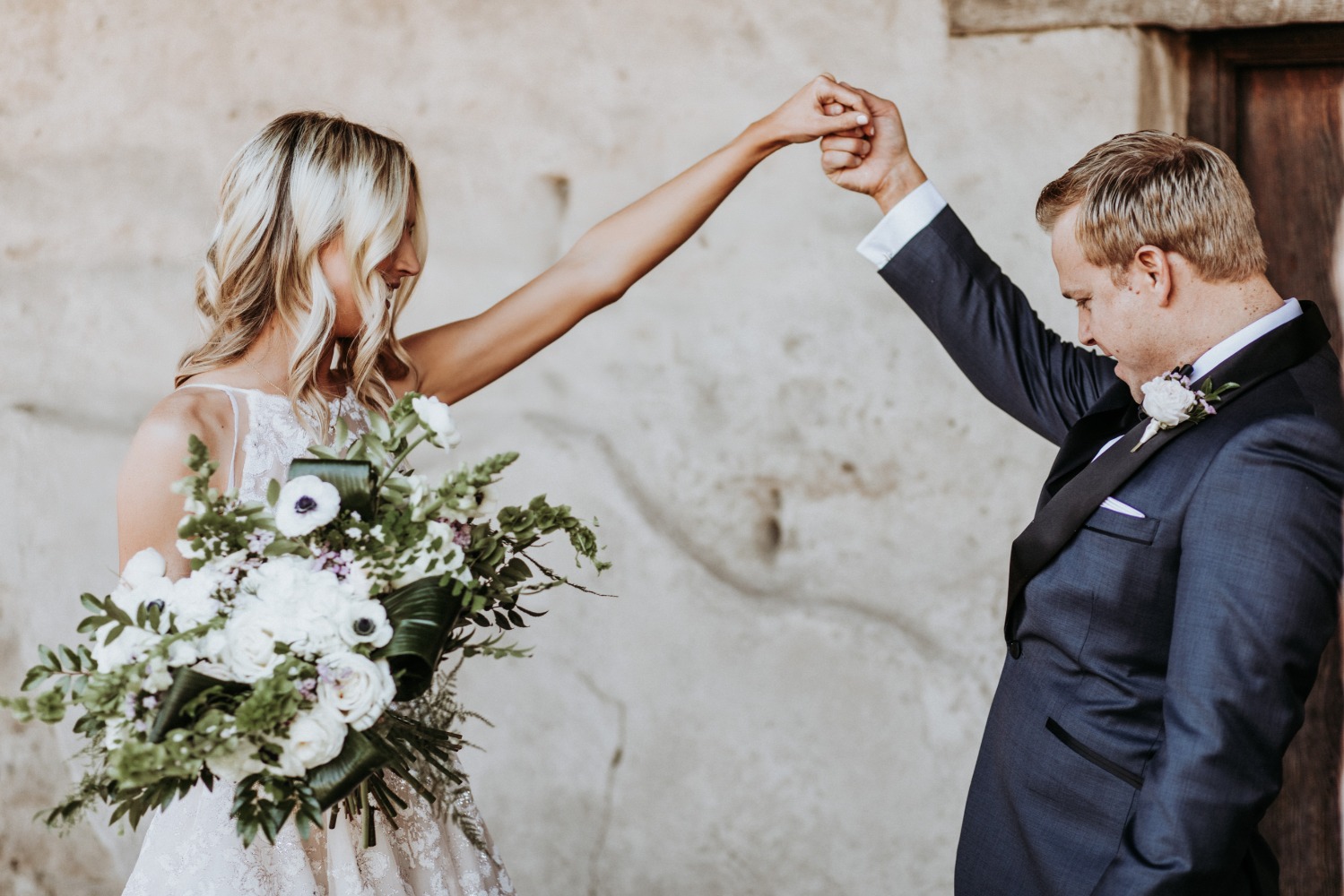 Bride and groom joyfully connect, celebrating their wedding day