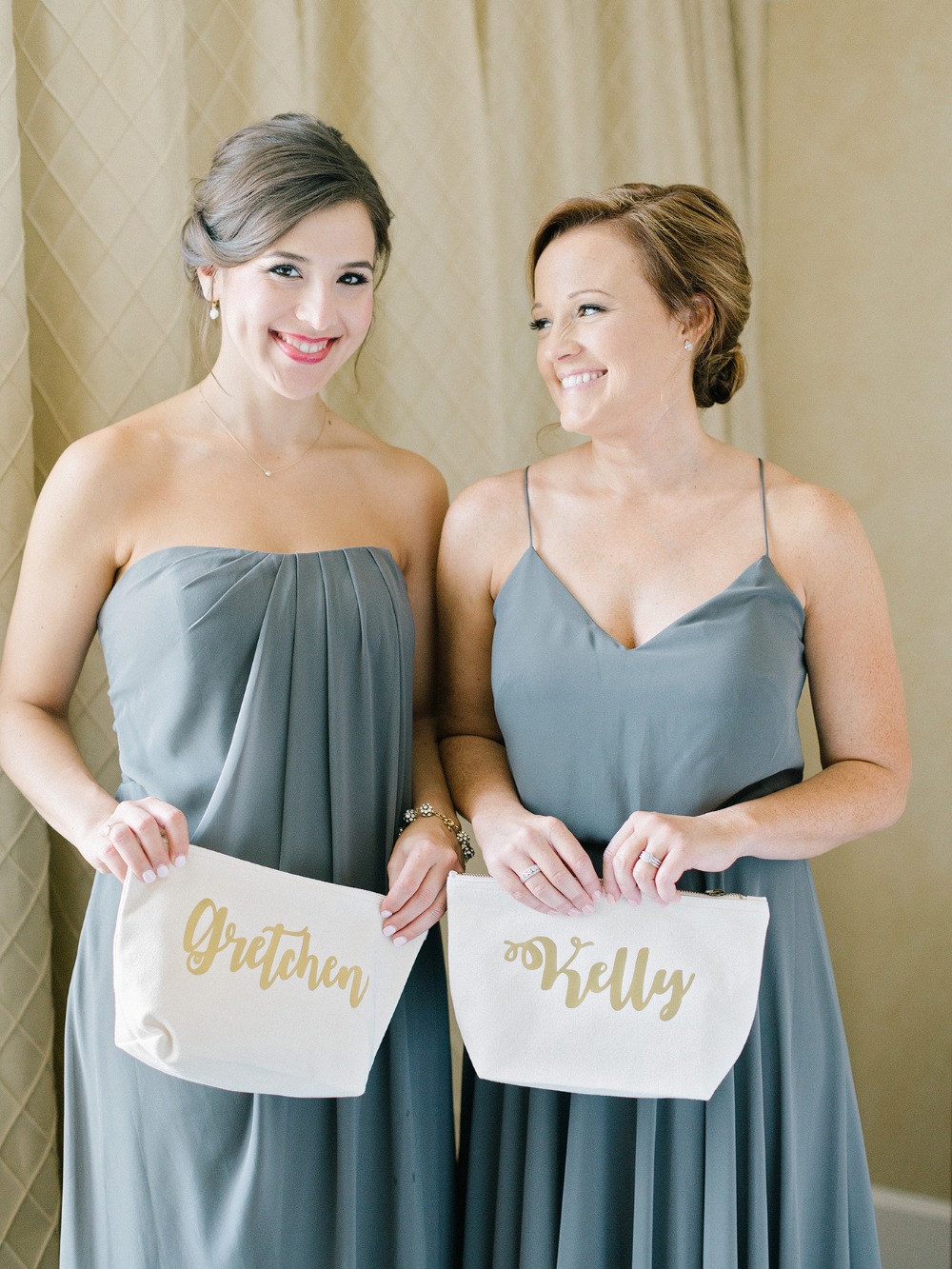 Bridesmaids Gretchen and Kelly hold personalized makeup bags