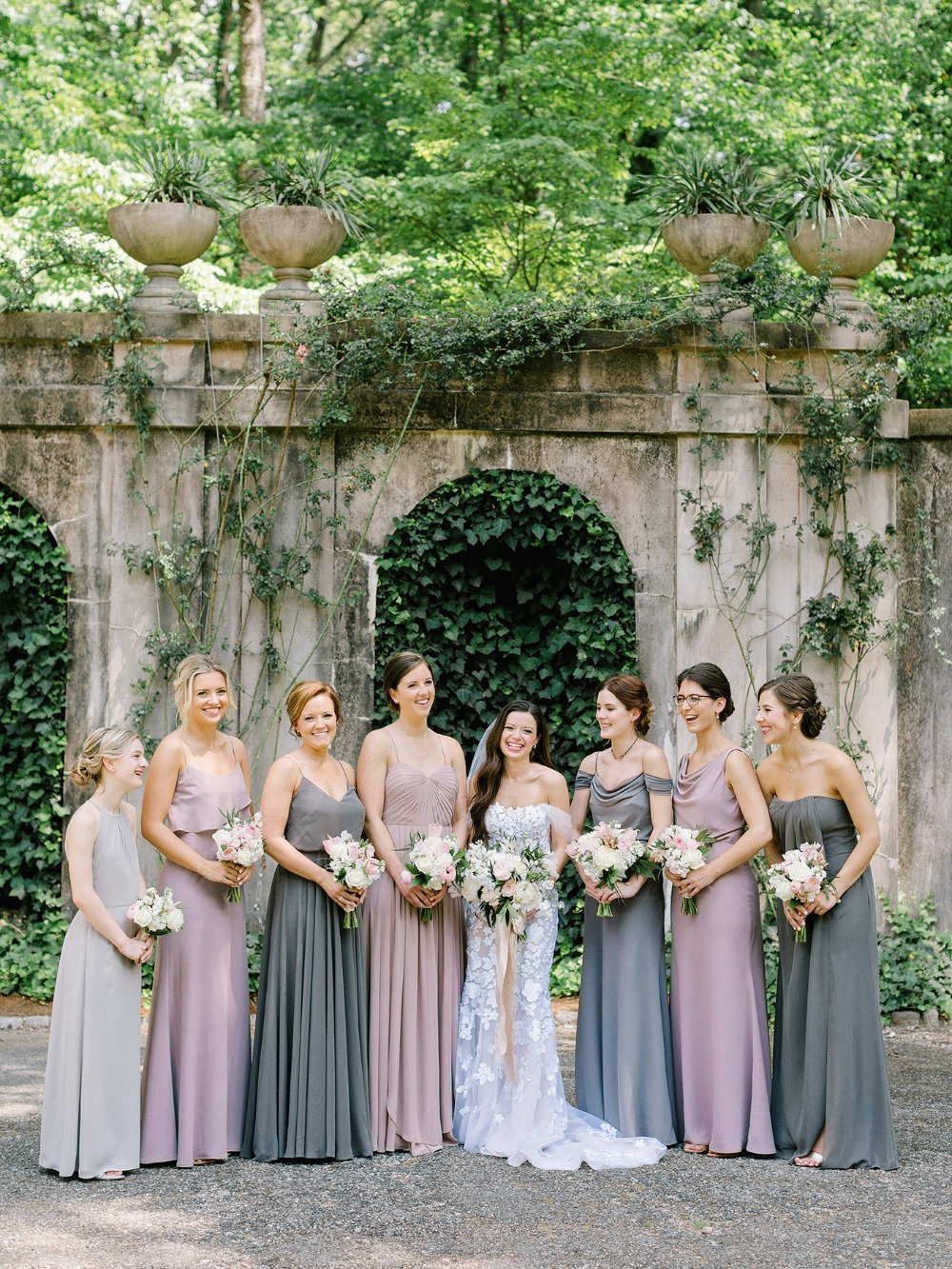Bride and bridesmaids in garden dresses colors gray lilac