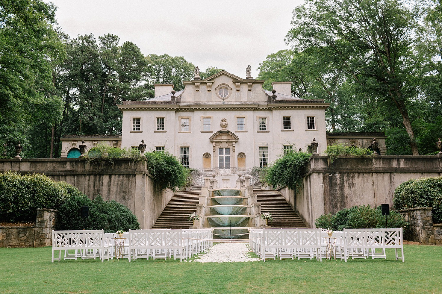 Elegant outdoor wedding venue with a grand manor house
