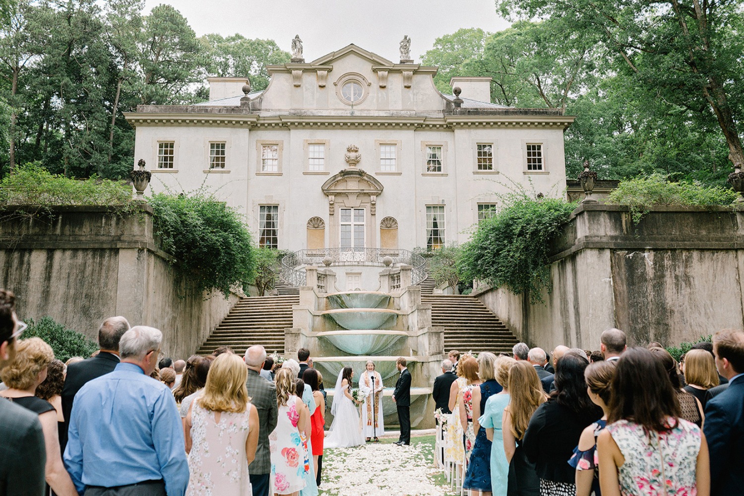 Swan House wedding with crowd of people looking the wedding