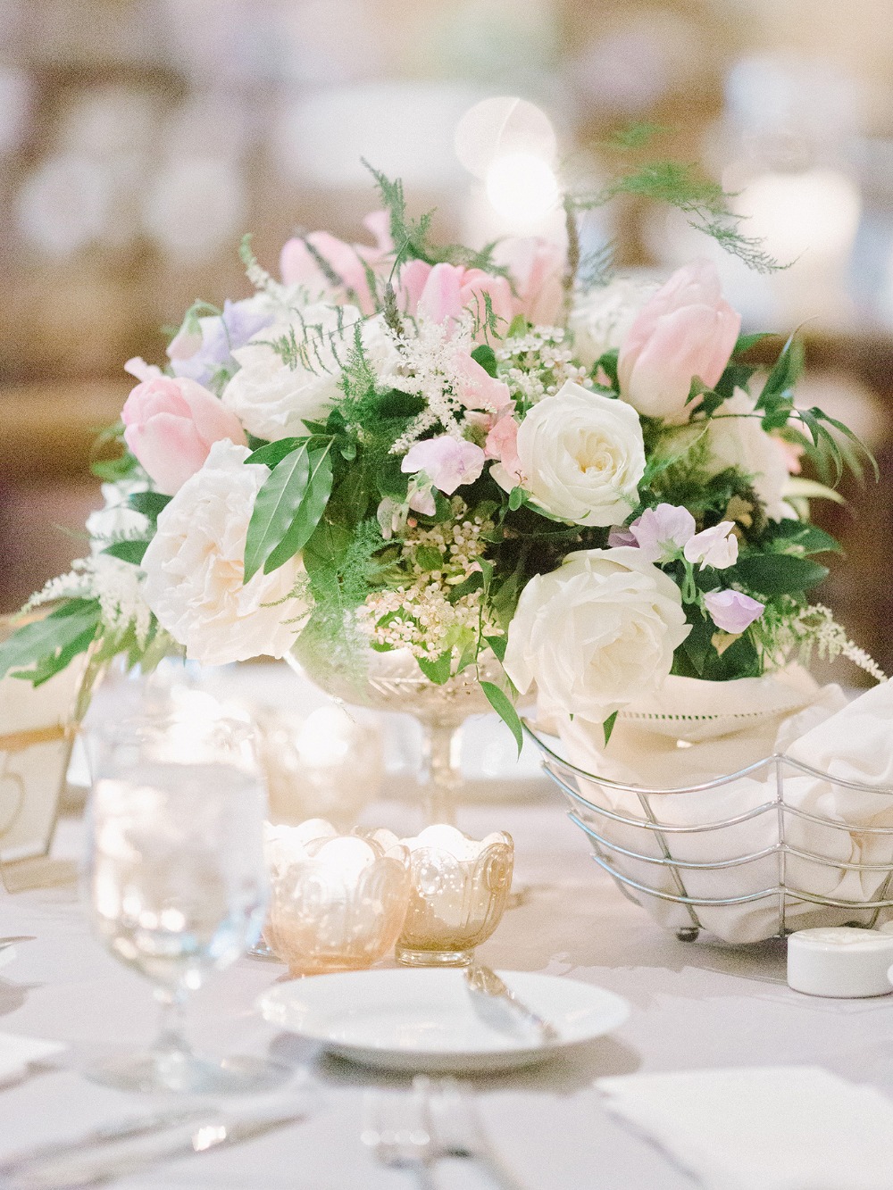 Elegant wedding centerpiece with roses and tulips
