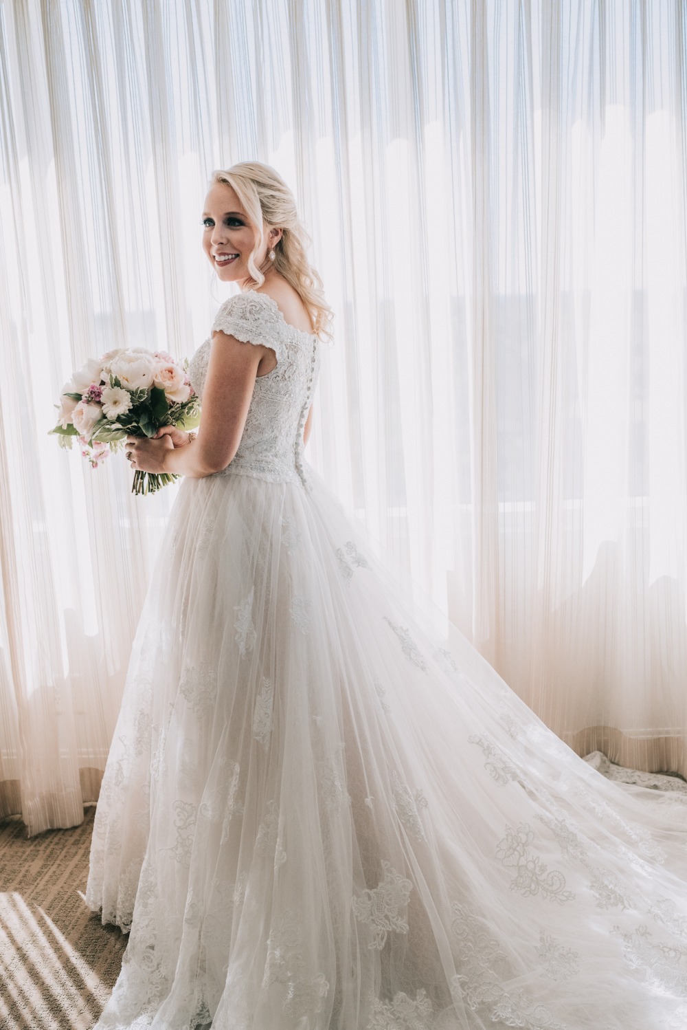 beautiful bride in Oleg Cassini wedding dress