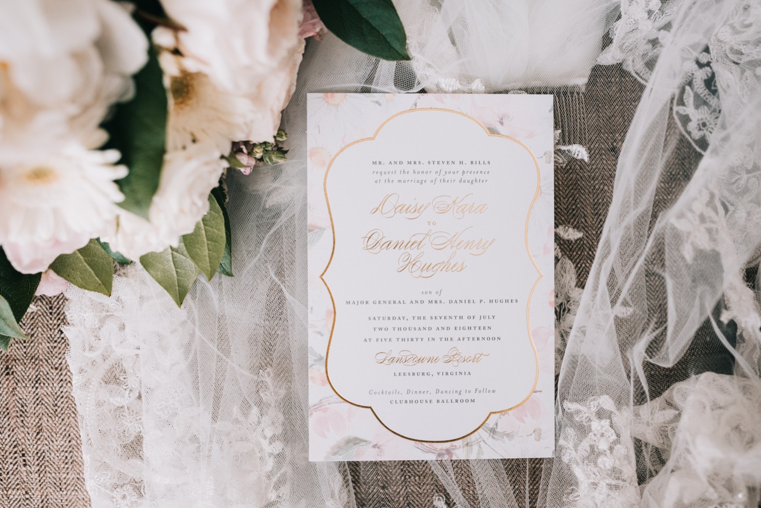 wedding invitation with flower and gold accents
