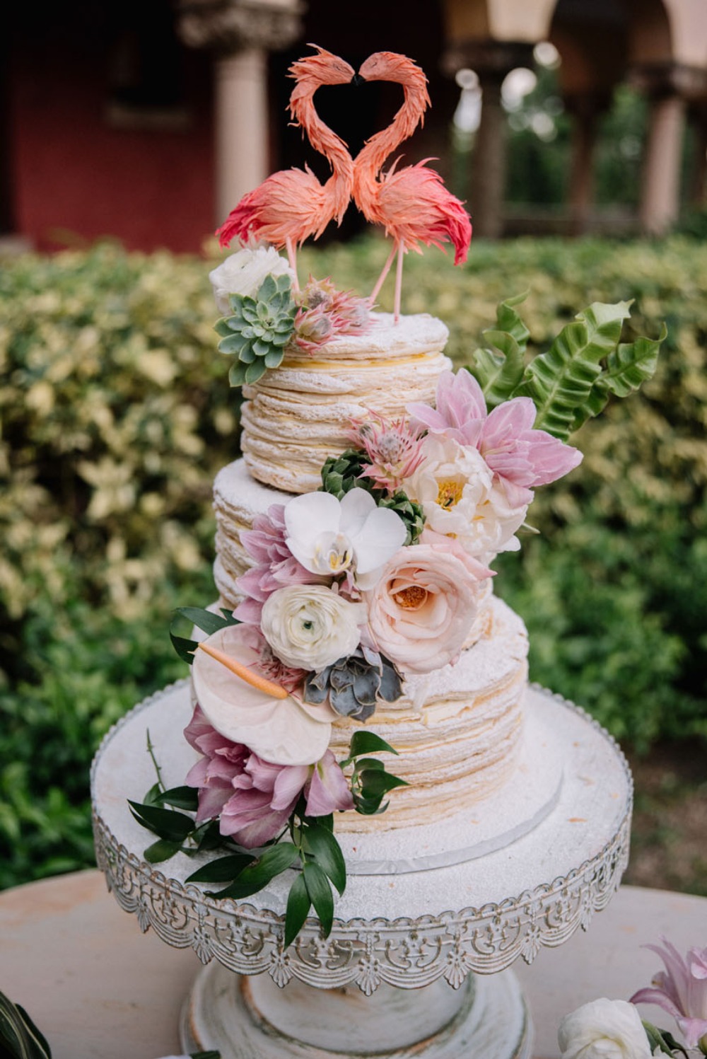 flamingo topped wedding cake