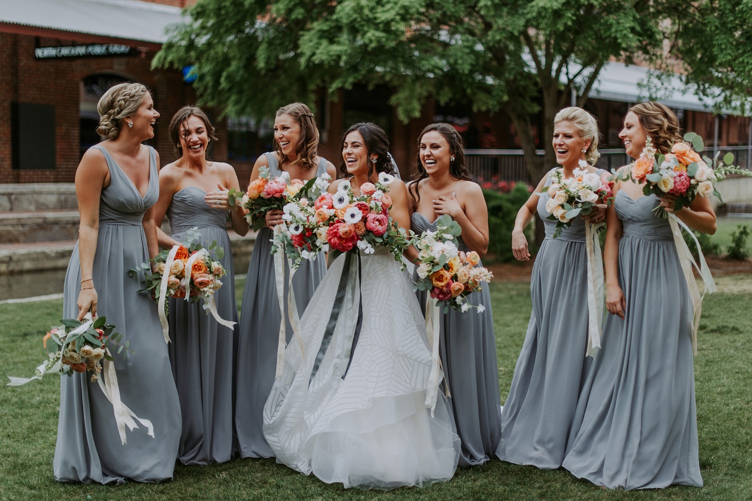 bridesmaids in soft blue grey dresses
