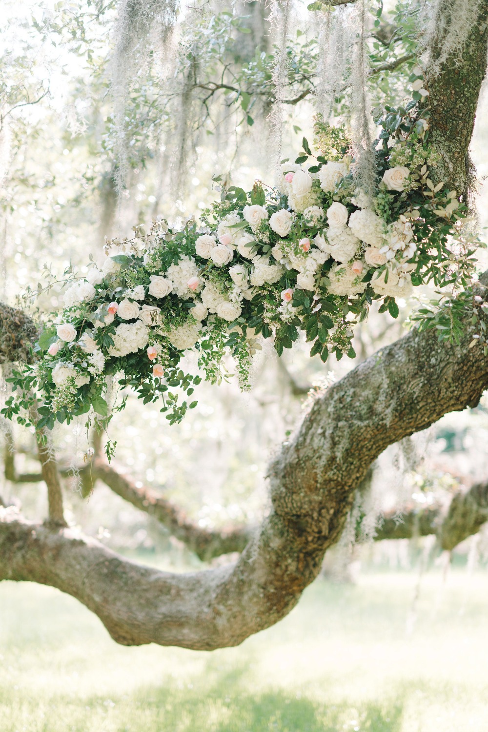 floral accented wedding ceremony backdrop