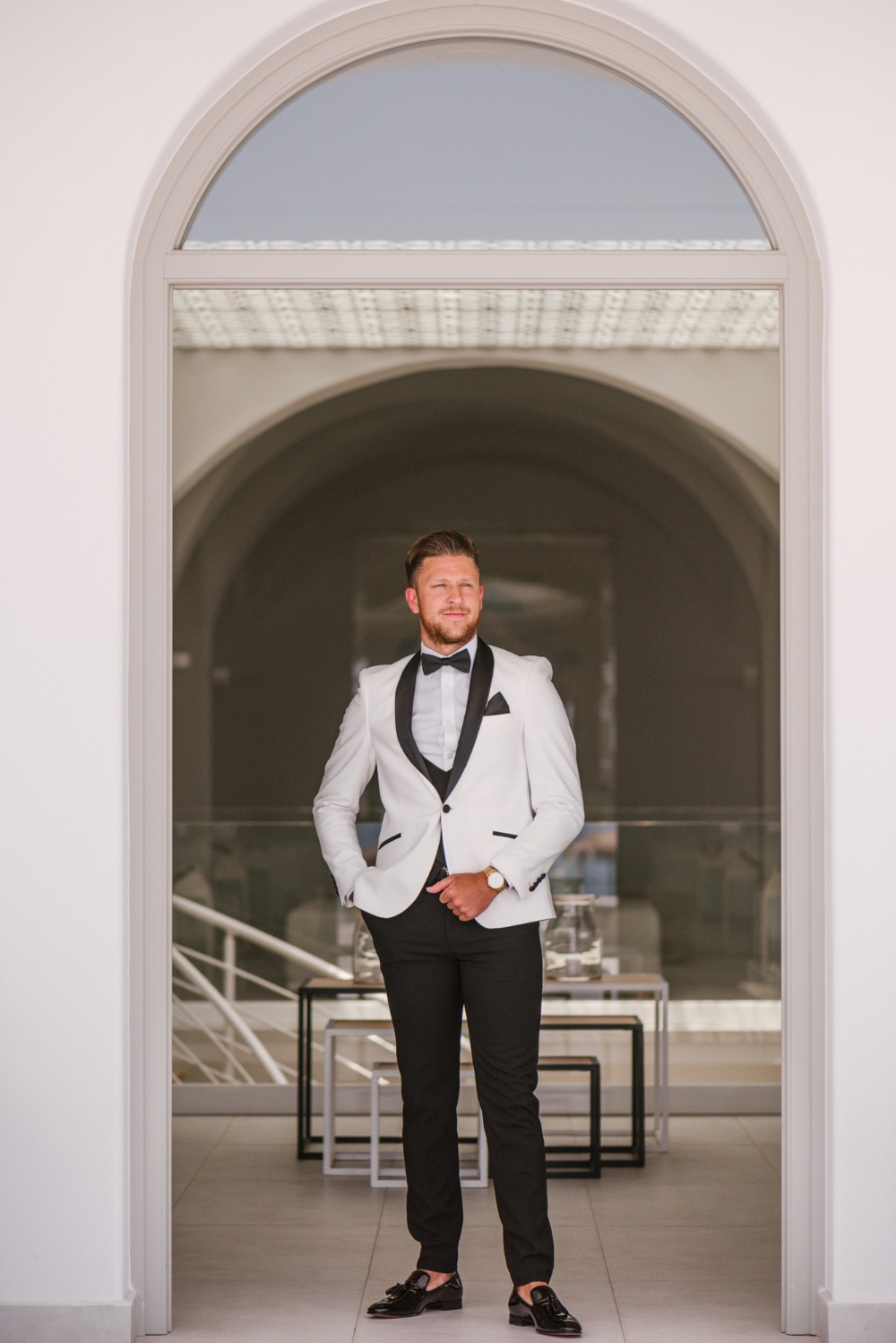 groom in stylish black and white