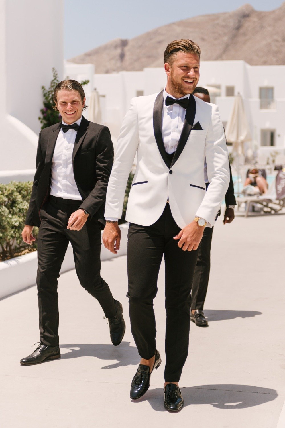 groom in white and black