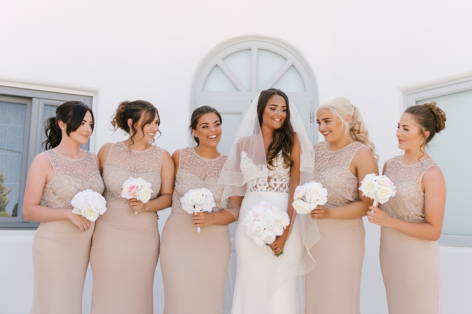 bridesmaids in sparkling champagne colored dresses