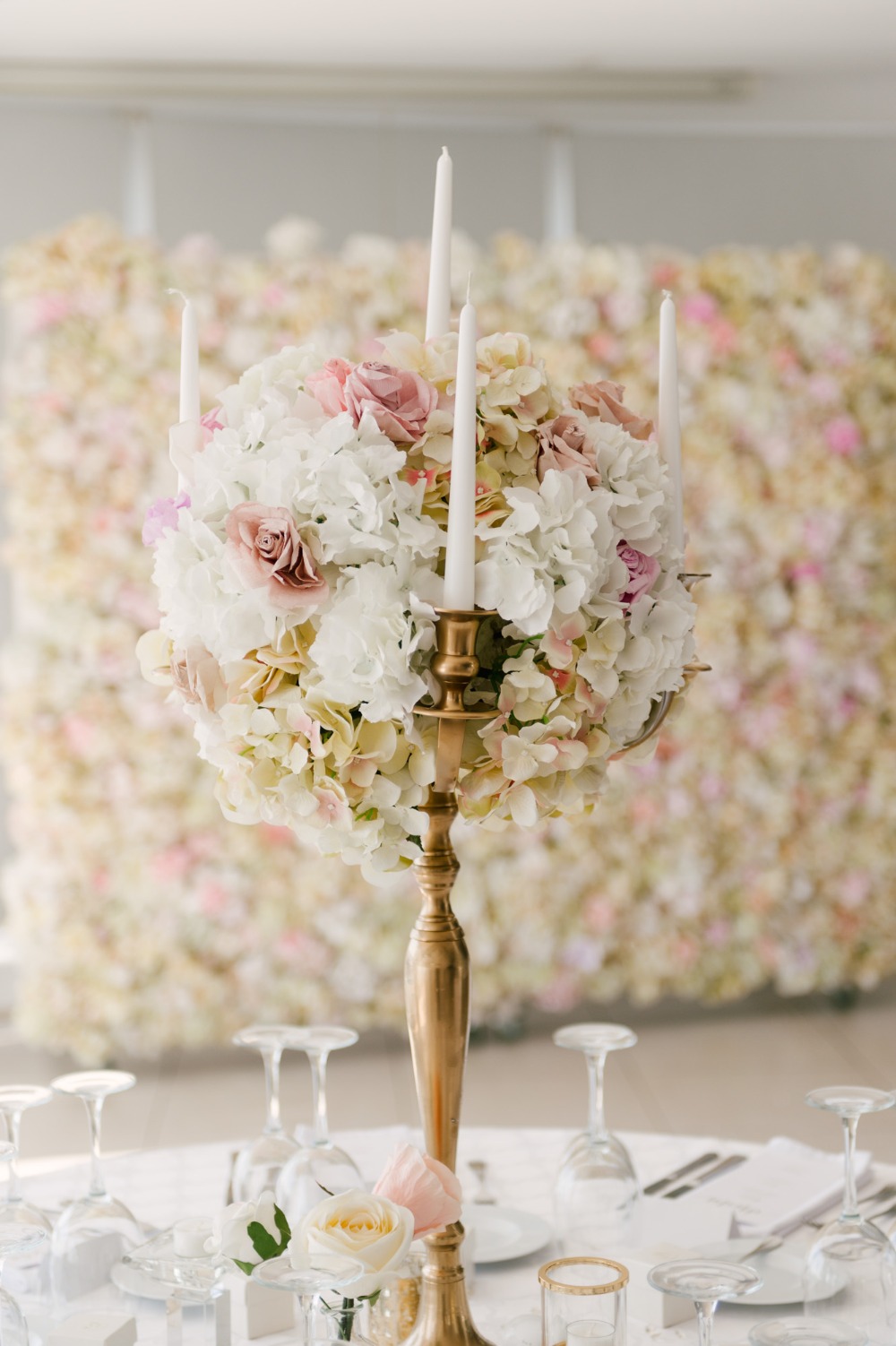 white and pink floral accented candelabra