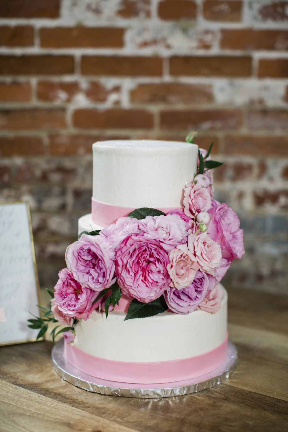 pink floral accented wedding cake