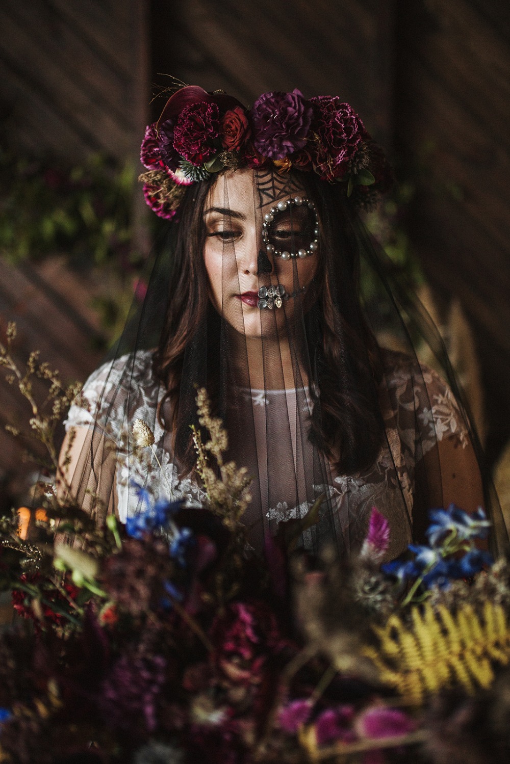 Bride in floral halo and day of the dead makeup