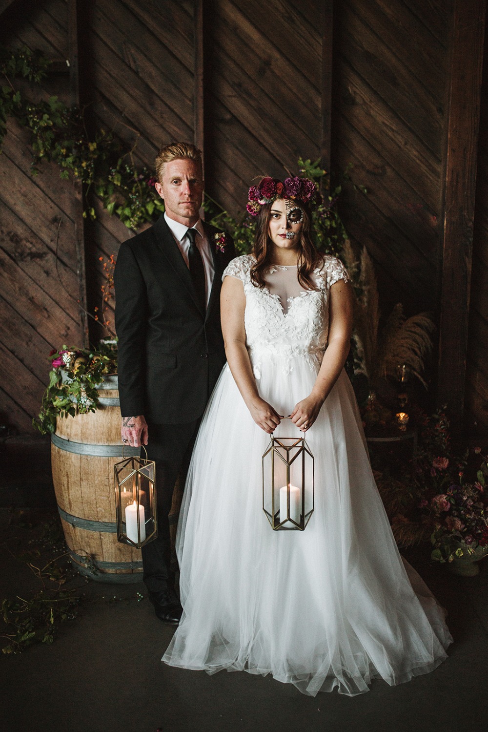 bride and groom with candle lit lanterns