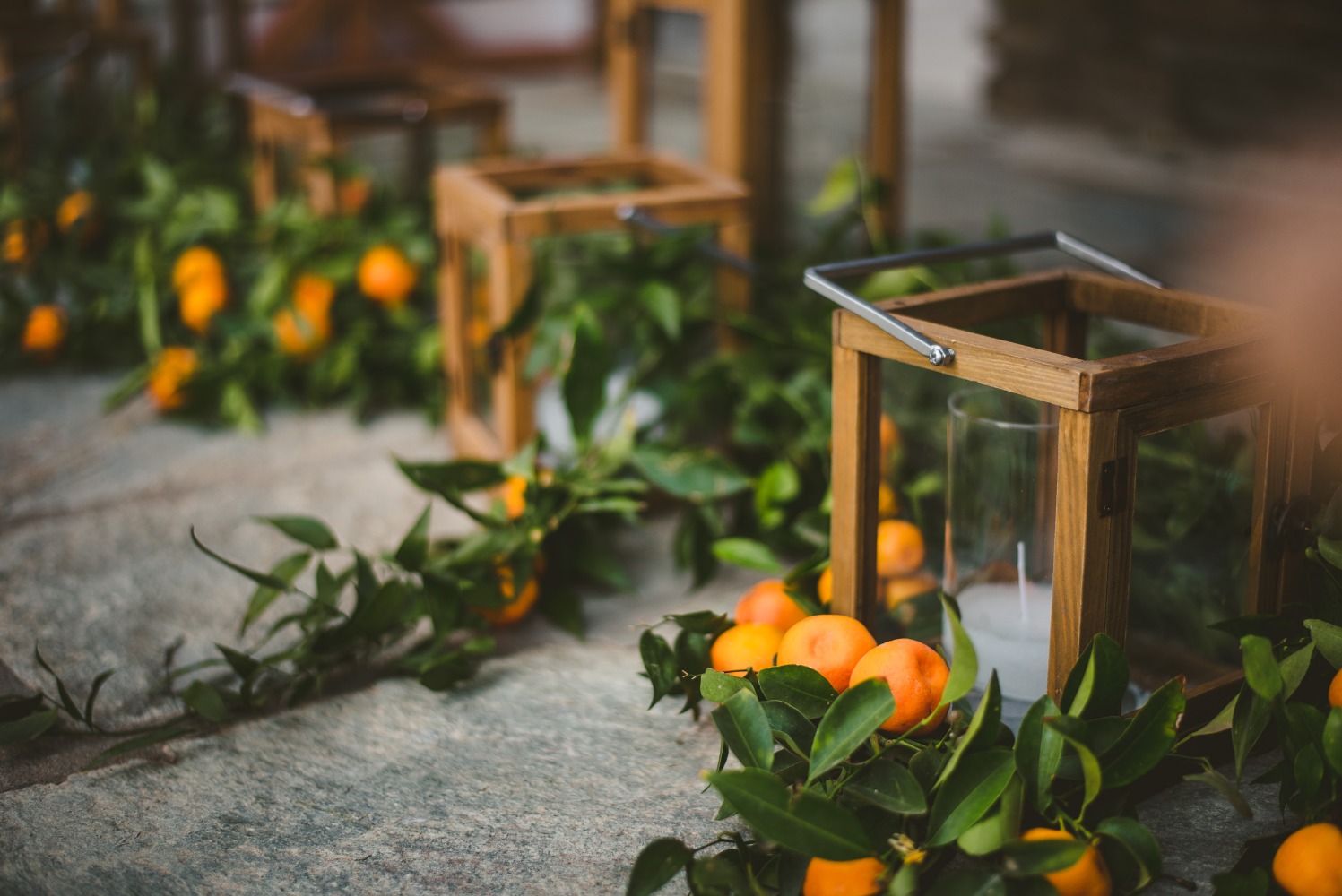 candle lanterns with kumquat accents