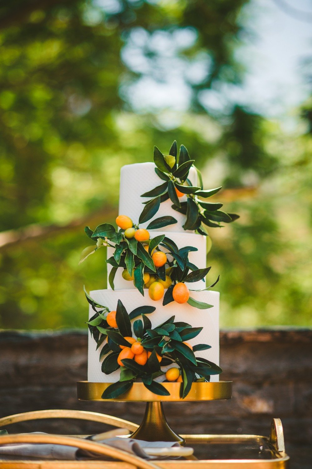 kumquat accented wedding cake