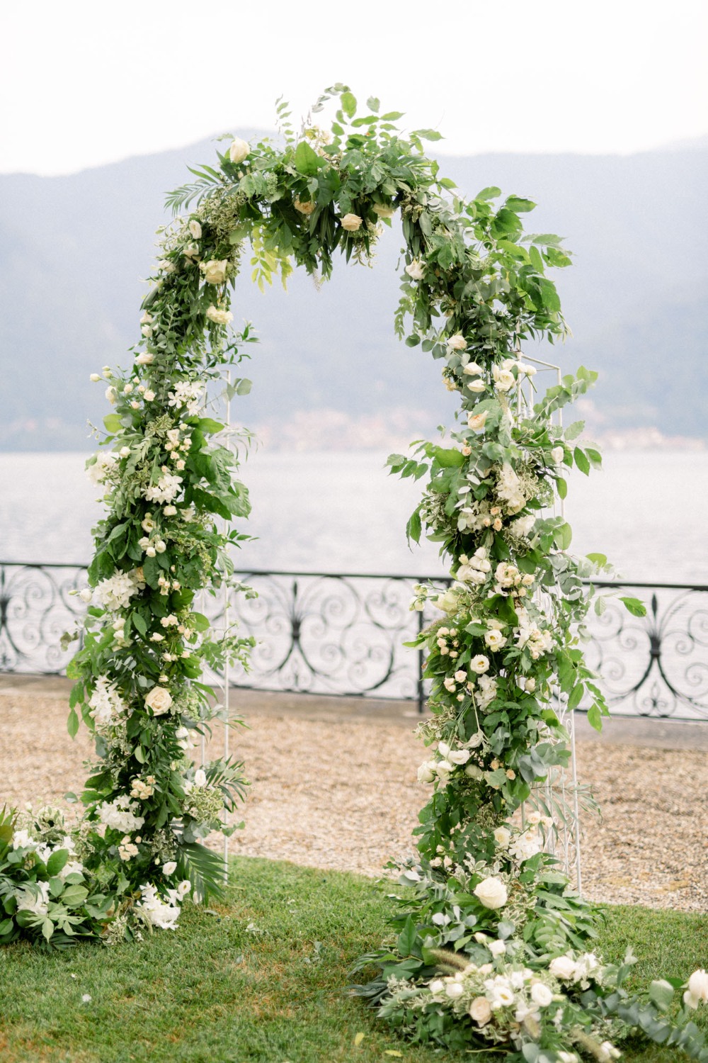 flower and greenery wedding arch
