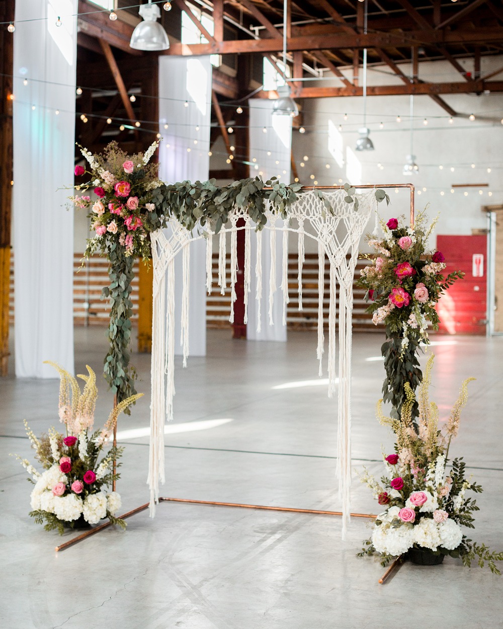 wedding arbor with macrame and florals