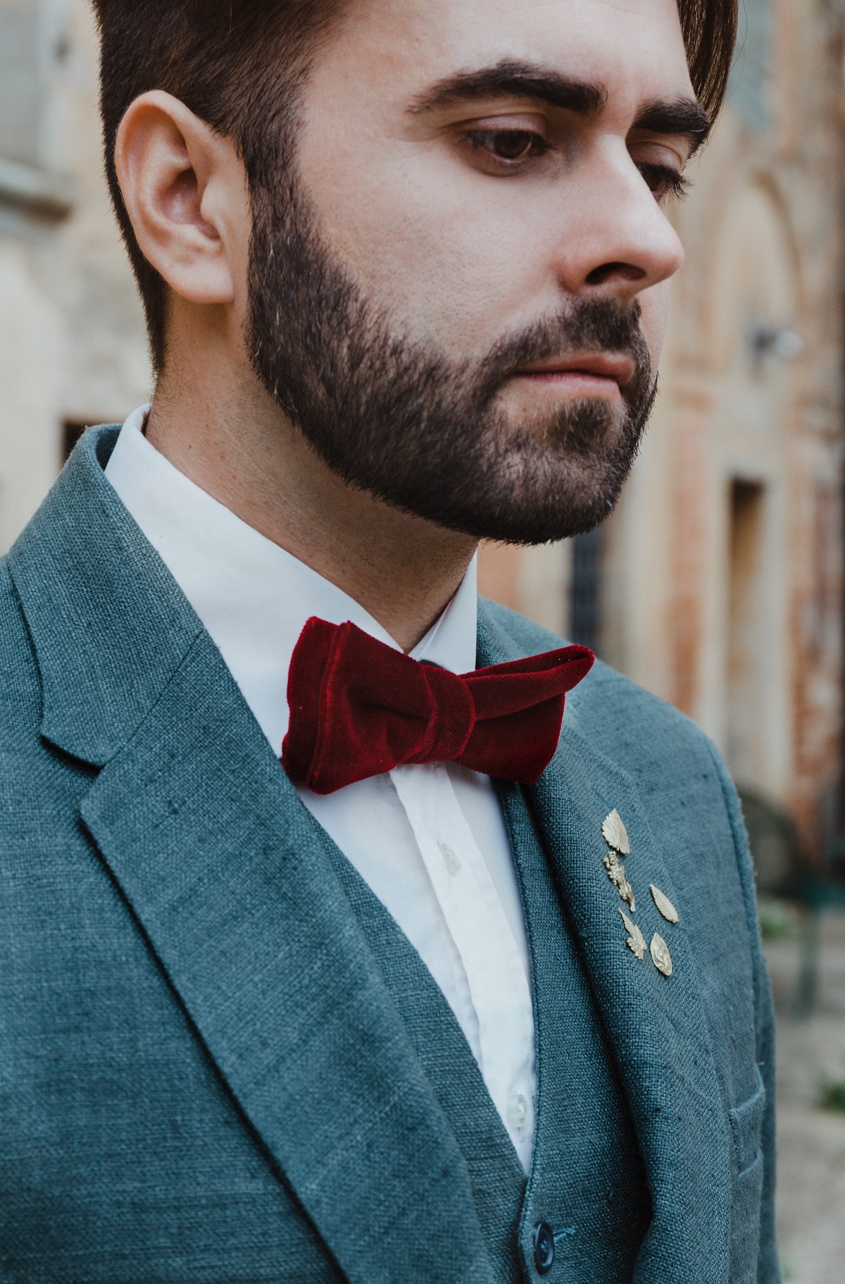 groom in red velvet bow tie