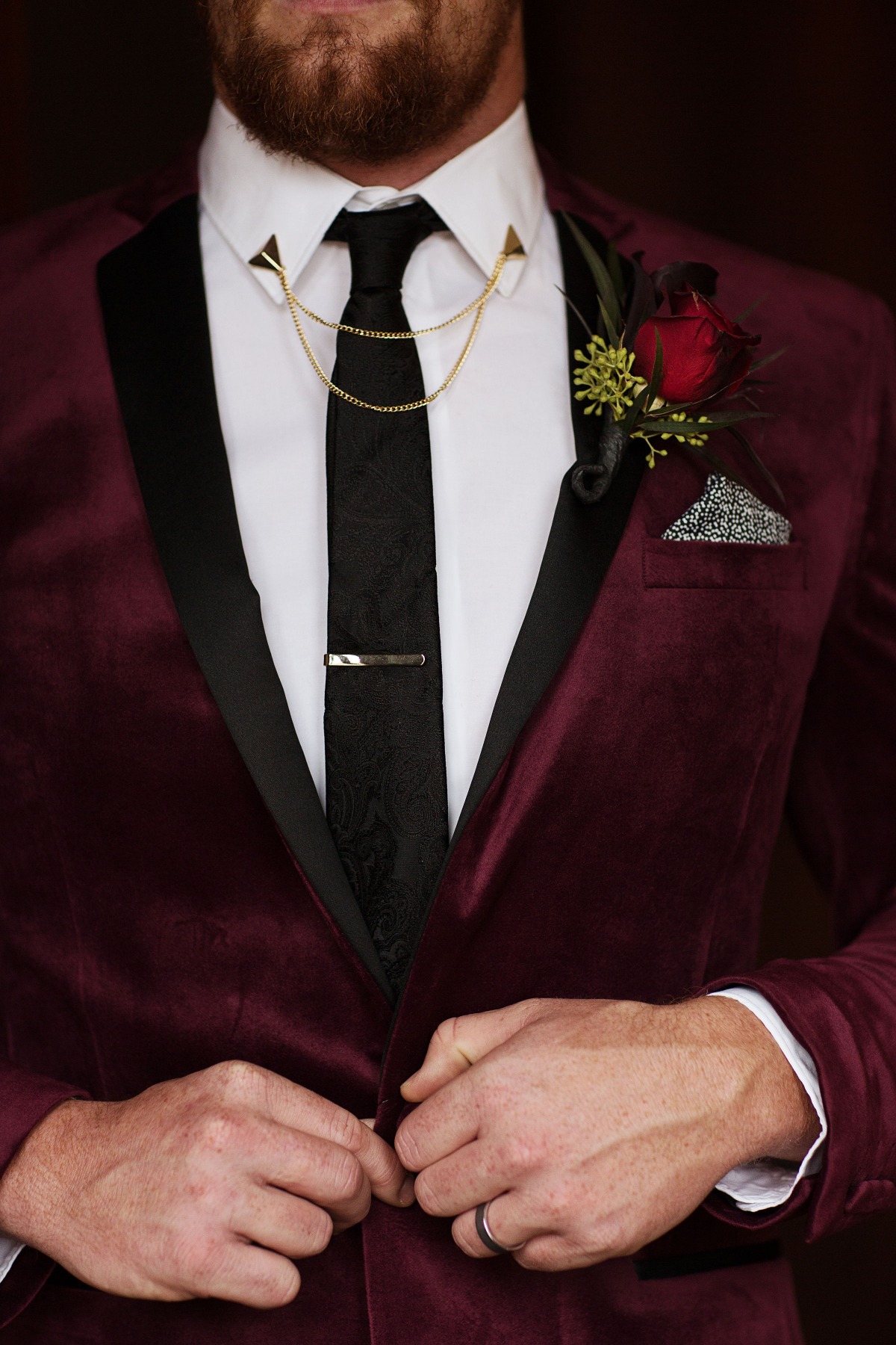 glammed up groom in burgundy velvet jacket