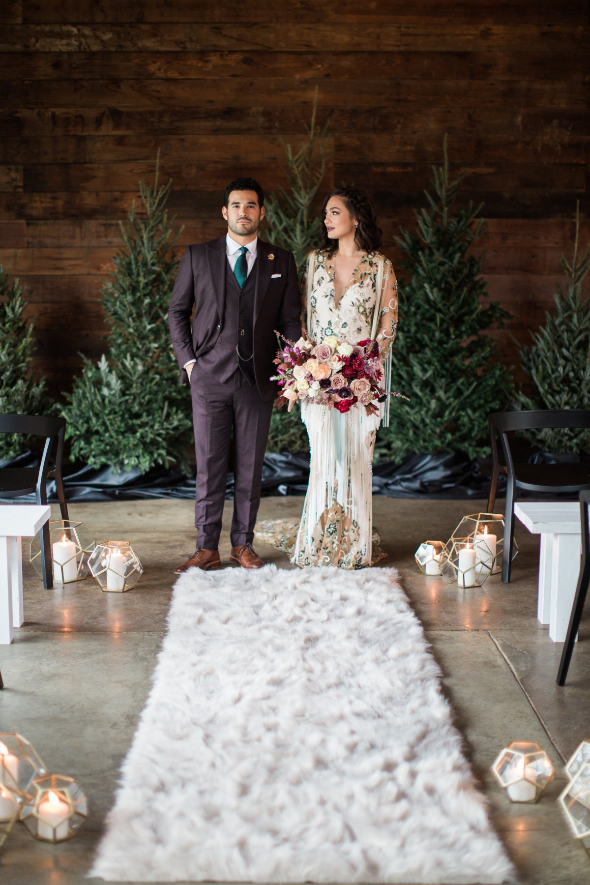 Elegant wedding couple standing near the altar with trees