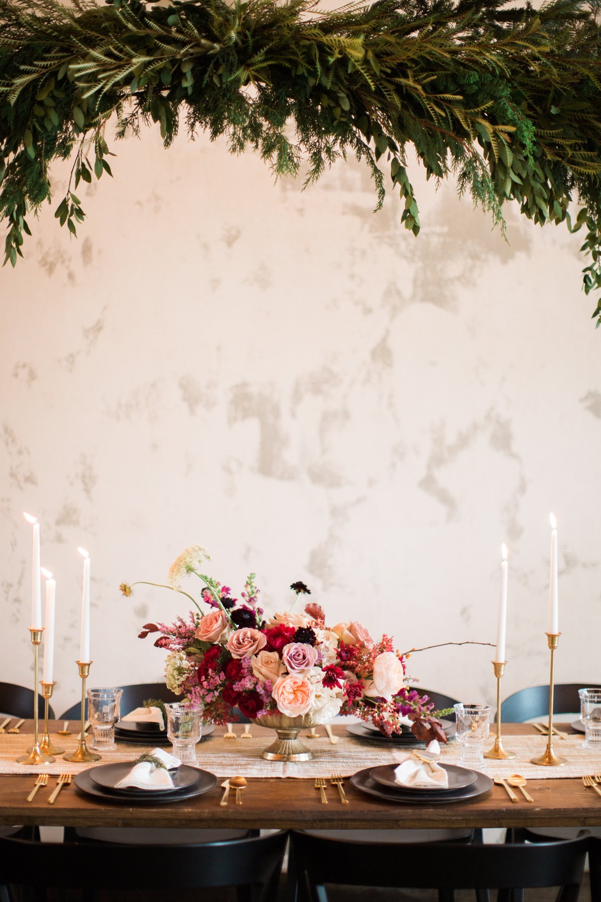 Elegant table setting with floral arrangement and candles