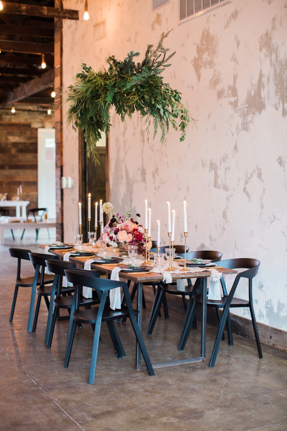 Elegant decorated table in a rustic space for an event