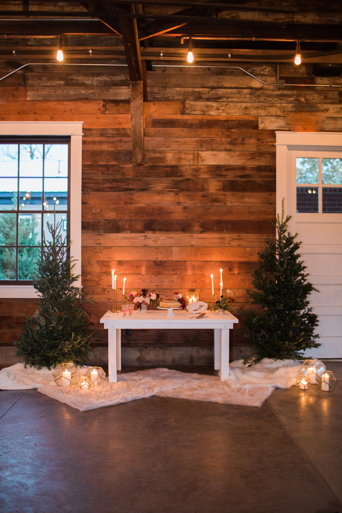 Cozy wedding reception with candles and rustic wooden background