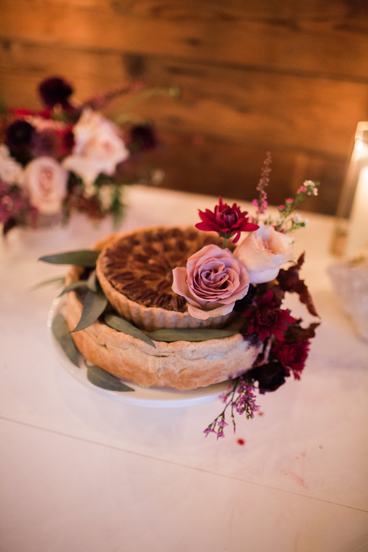 Floral decorated quiche on white plate at a wedding