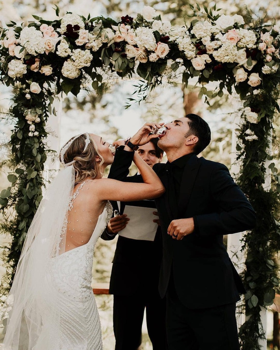 Couple taking shots at the altar