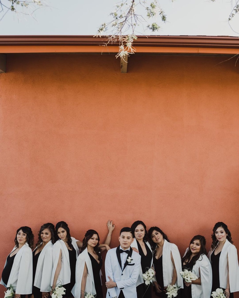 Groom and his bridesmaids in white blazers