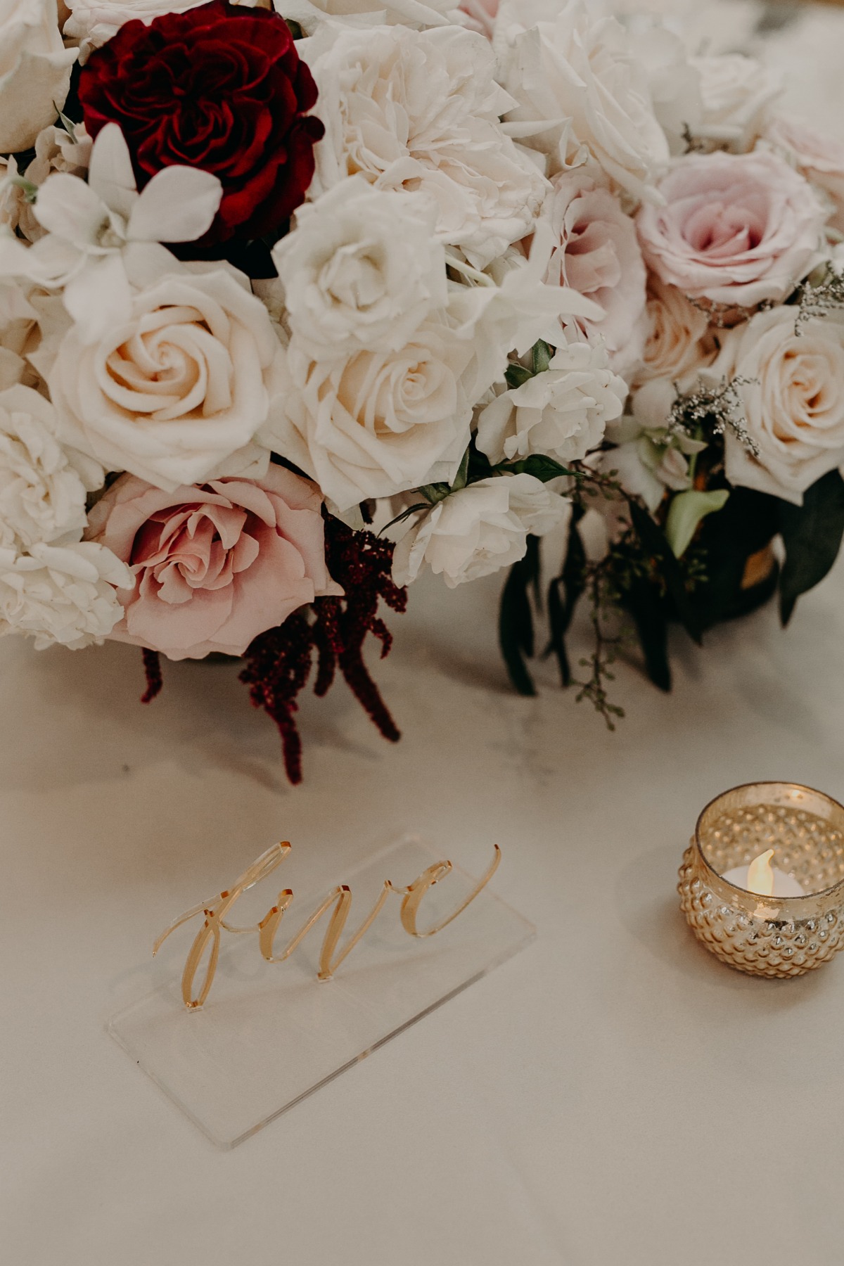 Elegant table setting with floral arrangement and candle