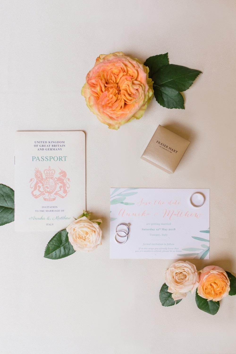 blush and green passport wedding invitations
