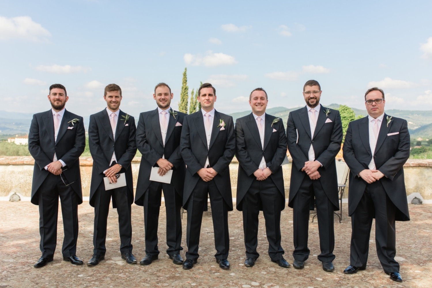 groom and groomsmen in formal tuxedos