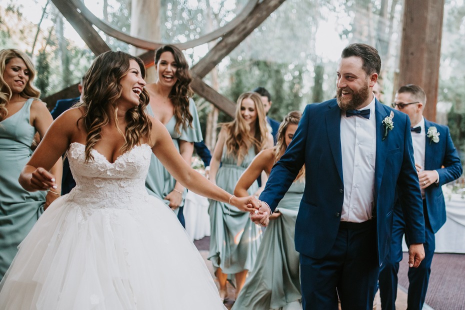 Joyful bride and groom celebrate wedding day with guests