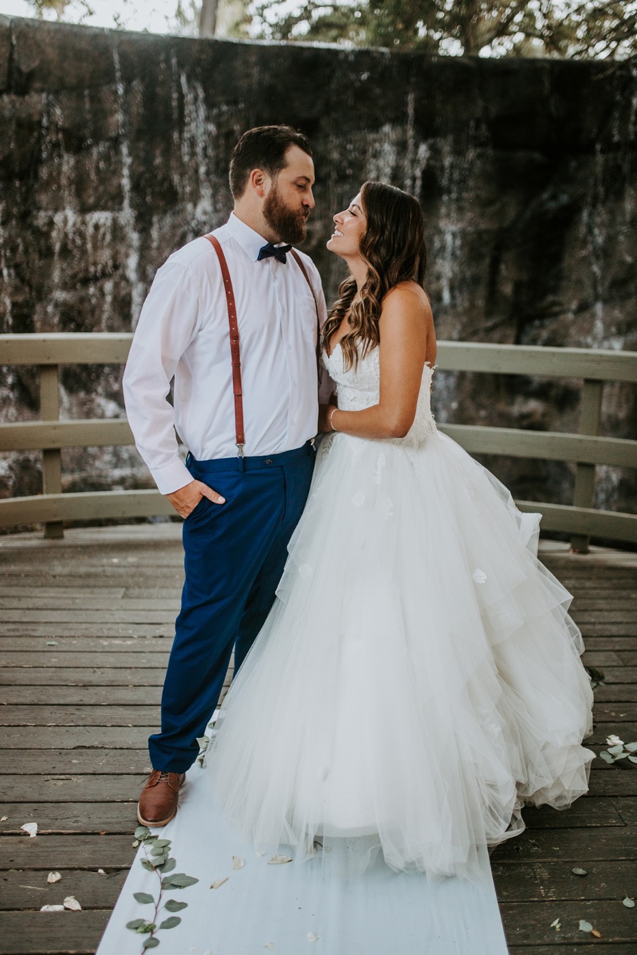 Romantic newlywed couple gazing at each other on their wedding day