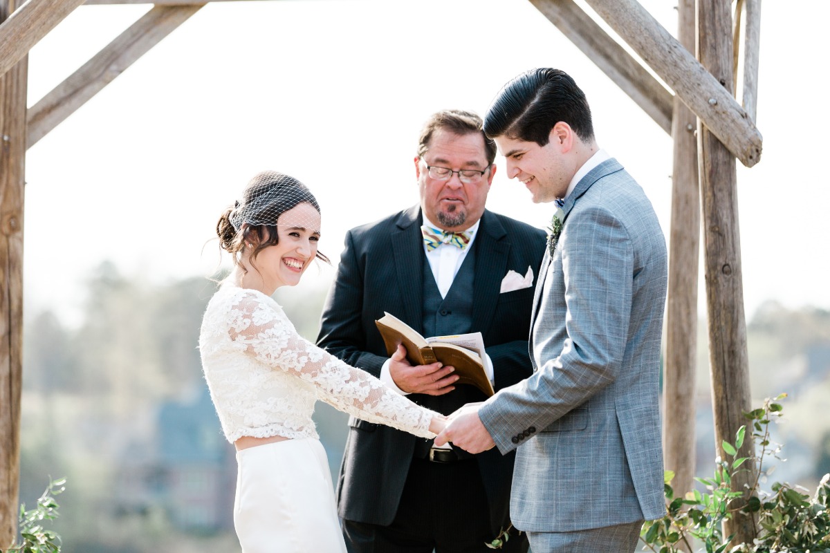 Joyful bride and groom at outdoor wedding ceremony