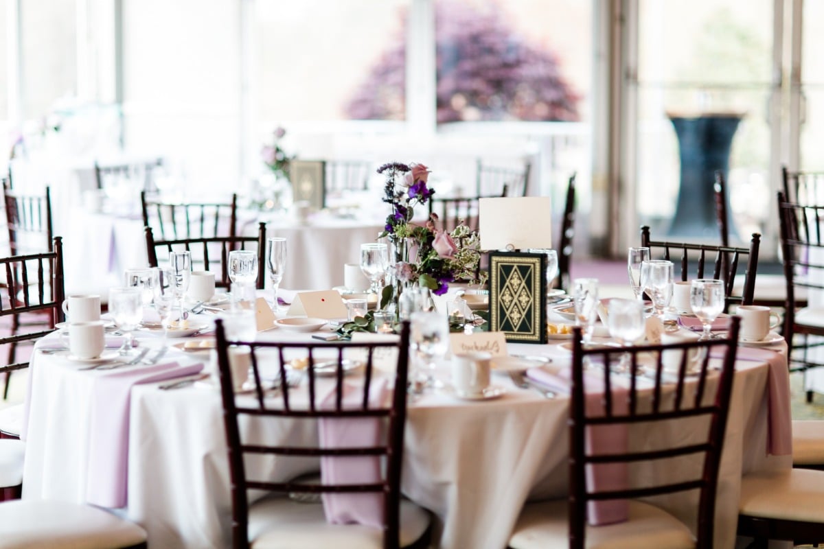 white and purple ballroom reception