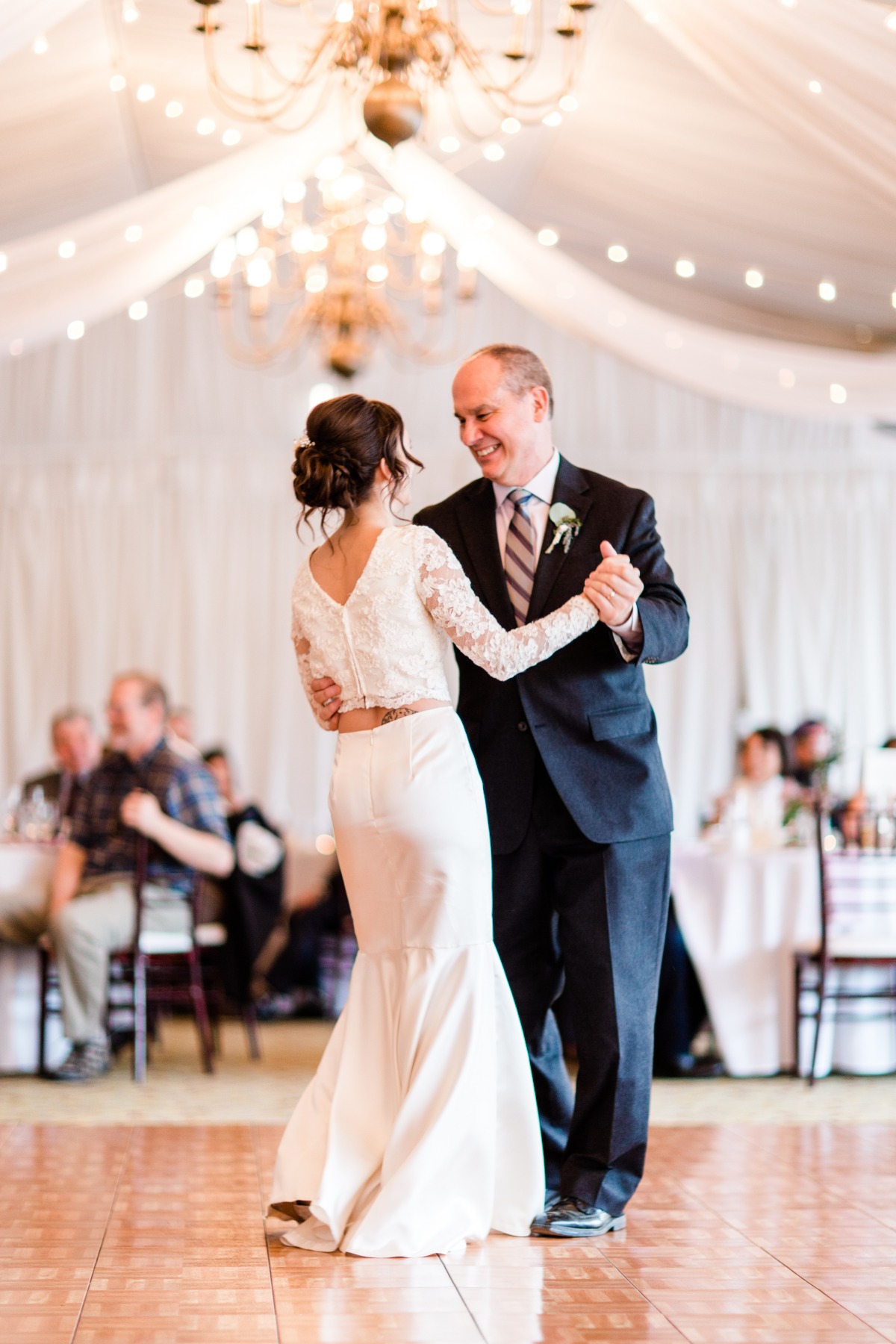 Father and bride share a dance at a wedding reception