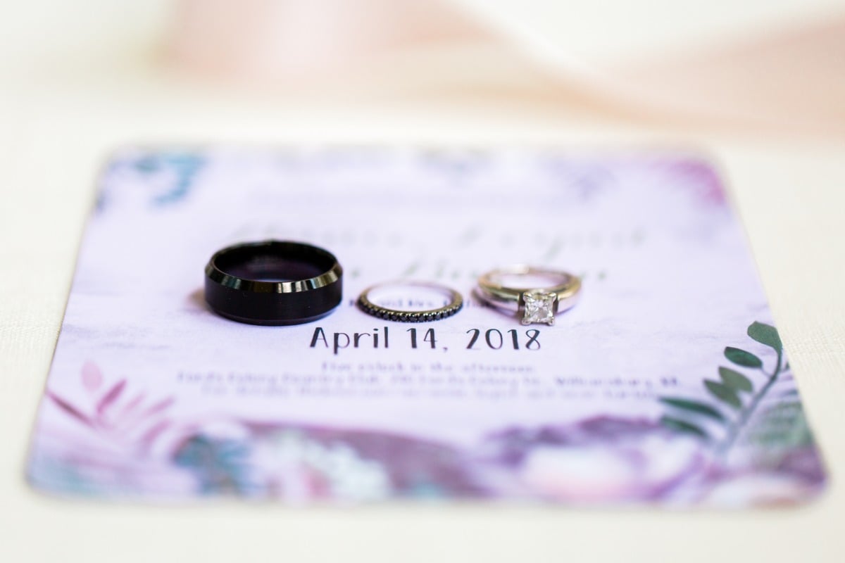 purple wedding invite and wedding rings