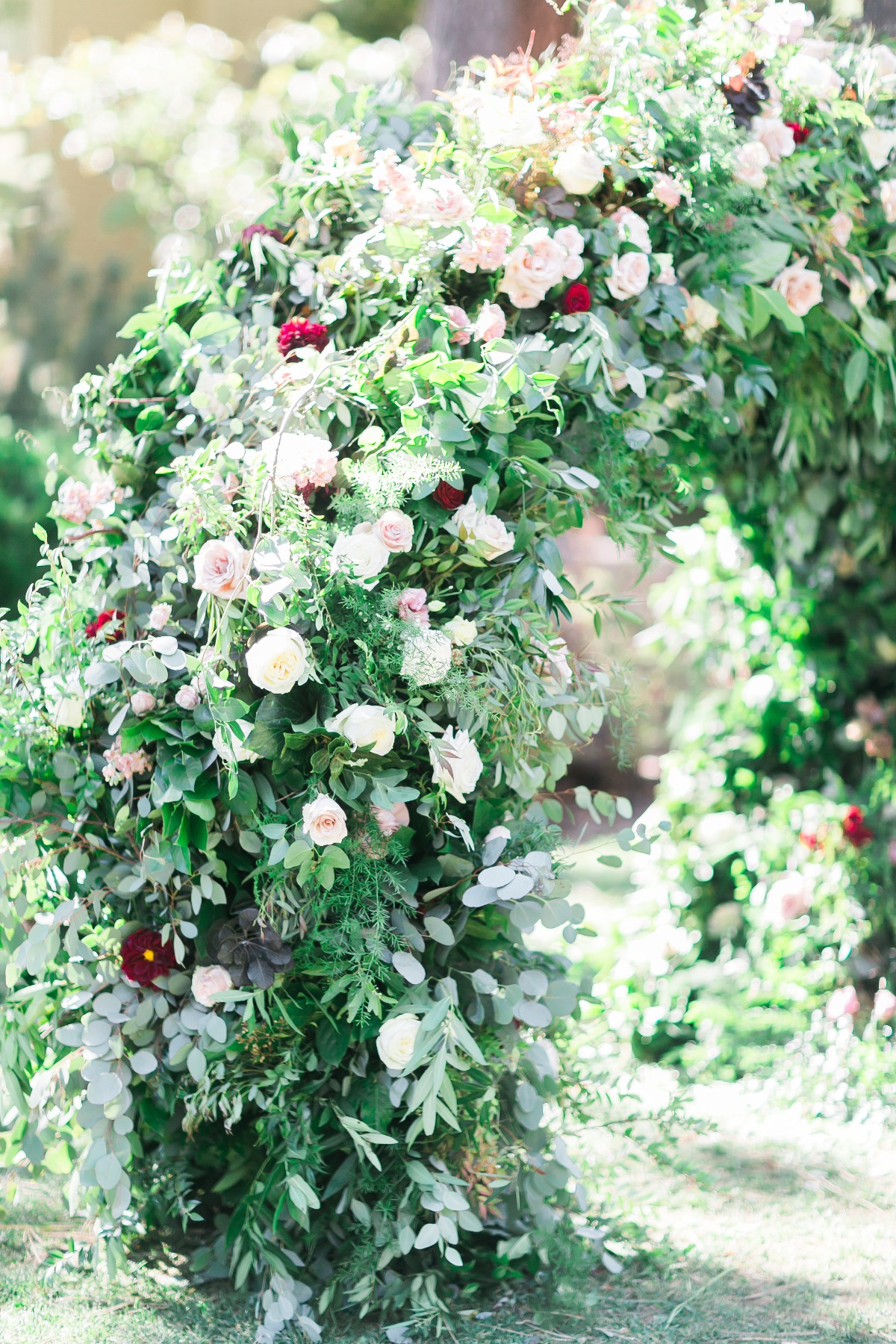 over grown floral wedding arch