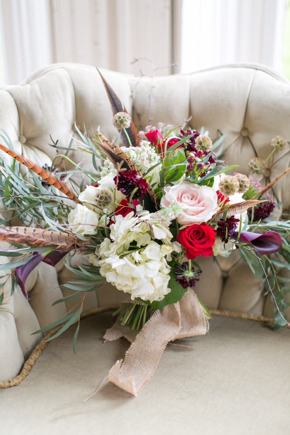 Winter wedding bouquet with feathers