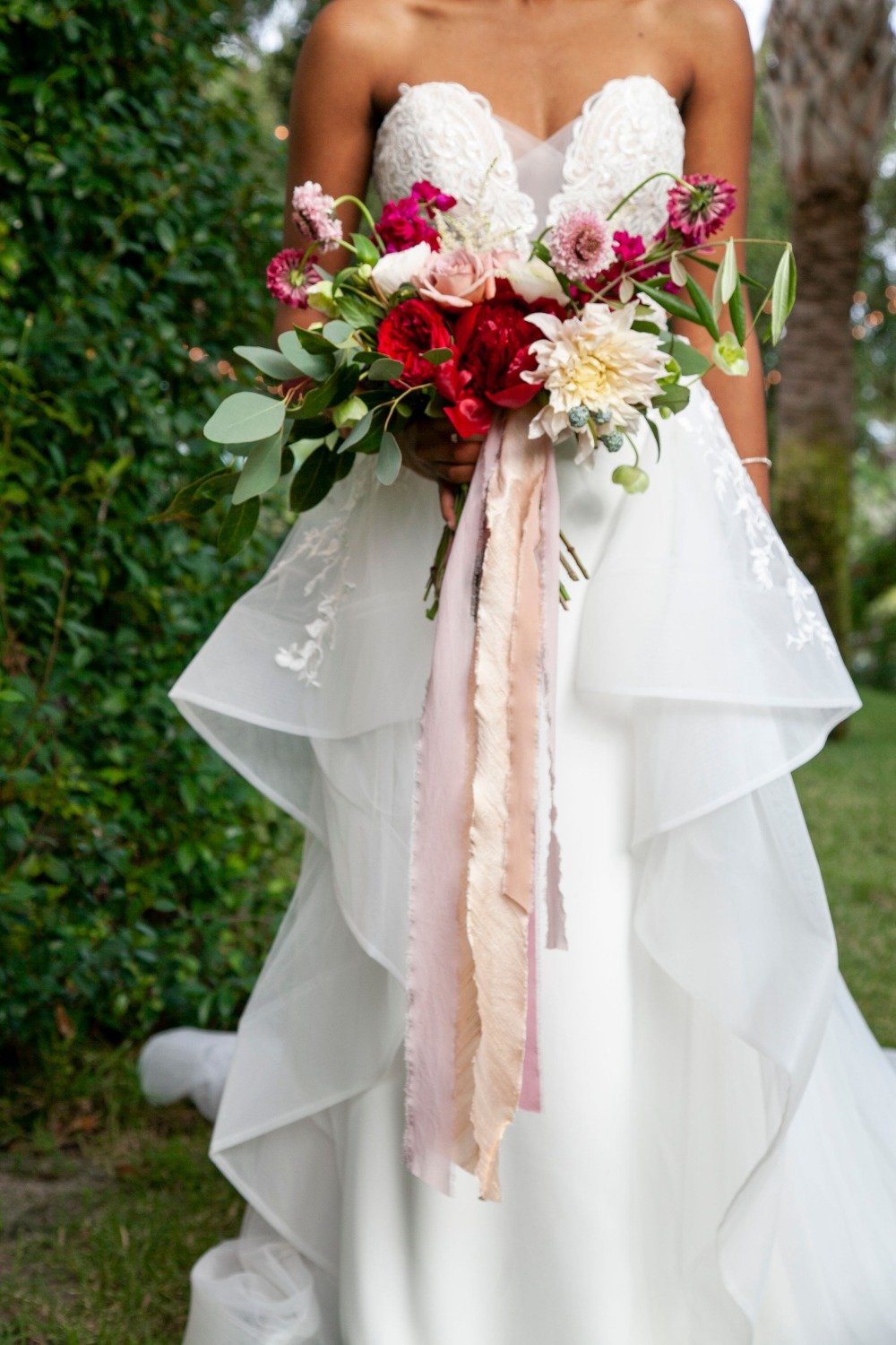 wedding dress and pink bouquet