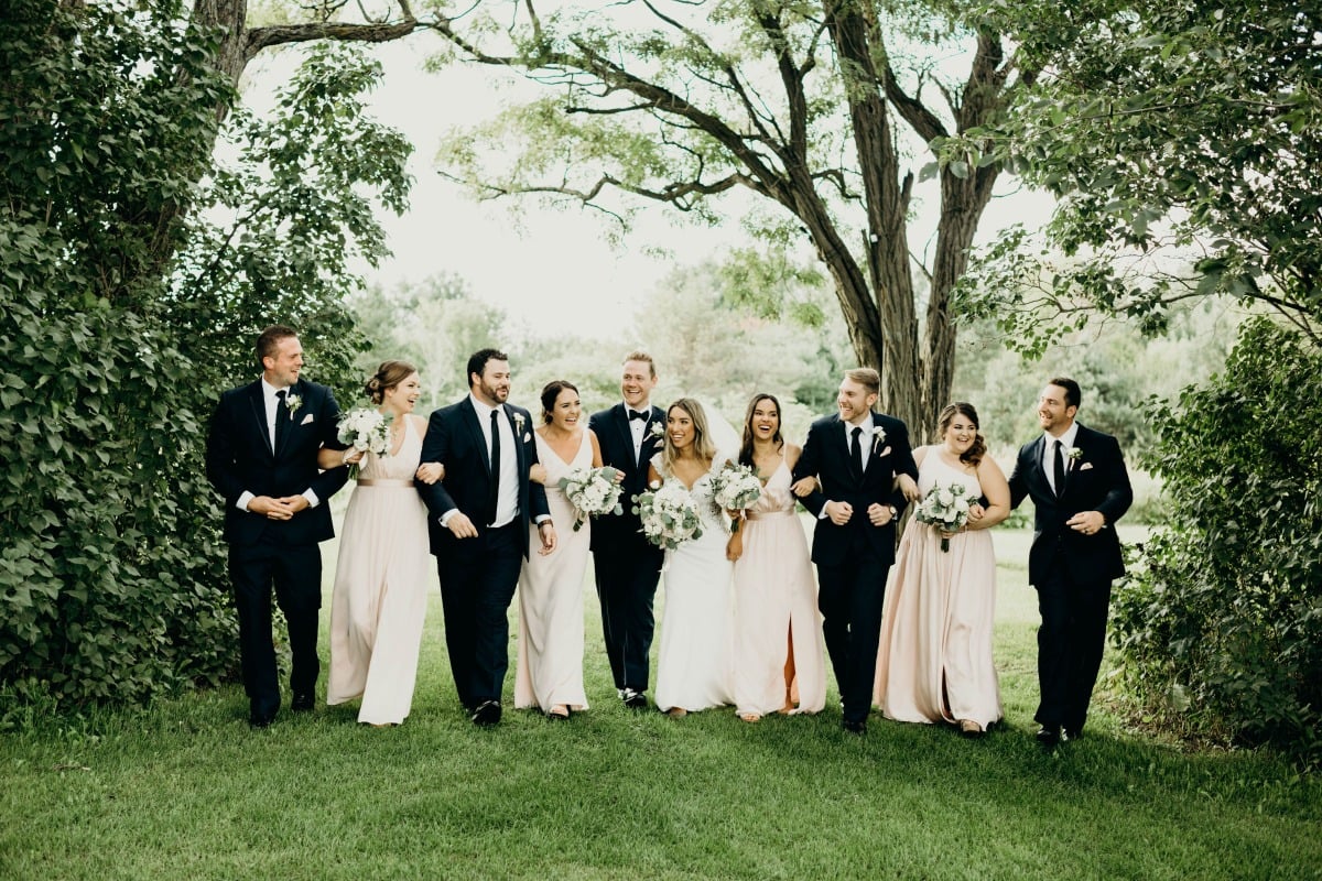 formal wedding party in black and blush